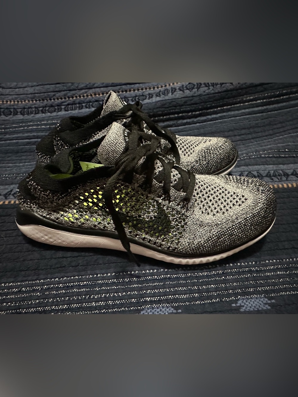 Nike Flyknit Running Shoes in Grey and Black with neon yellow insole.
